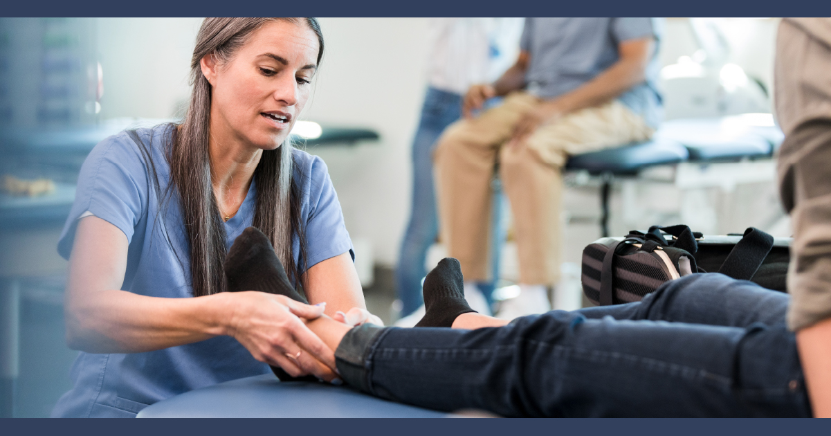 Physiotherapist working on the leg of a patient