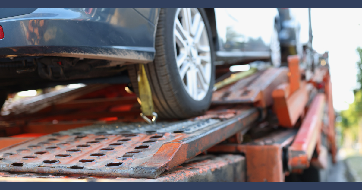 Car on a tow truck after a road accident