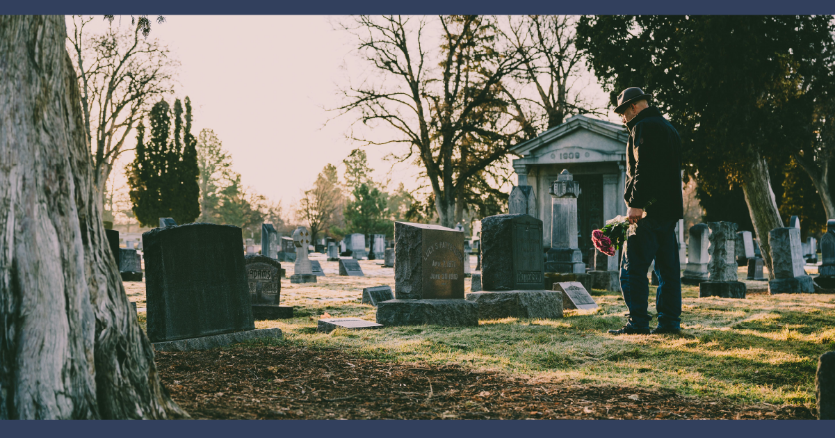 Person visiting a grave