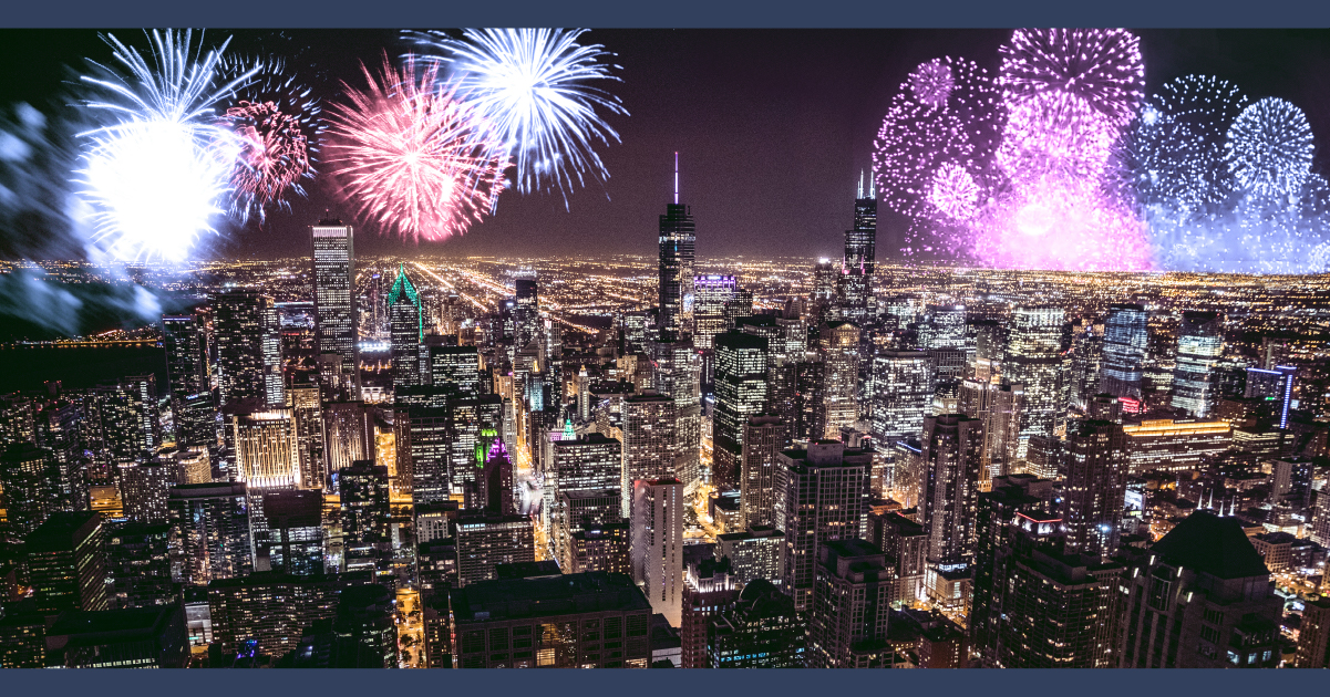 fireworks exploding over the city skyline