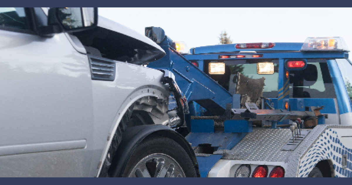 Truck being towed away after an accident