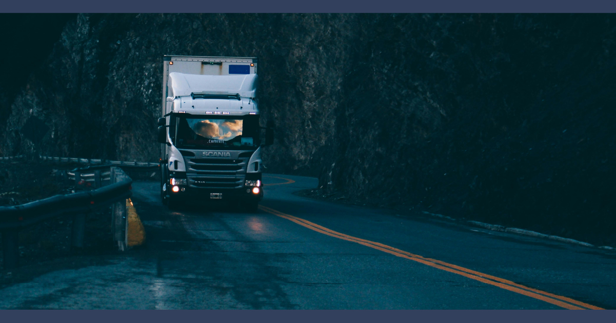 Truck driving on the road at night