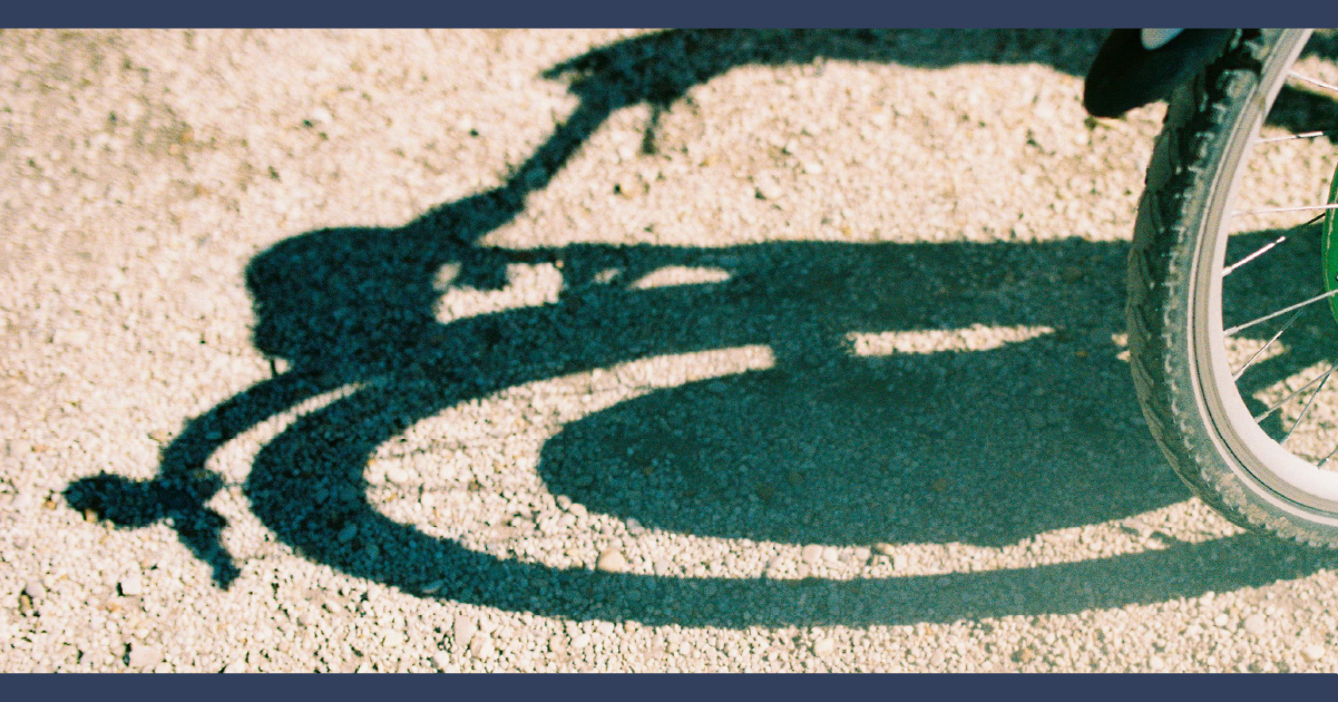 Shadow of a bicycle on asphalt