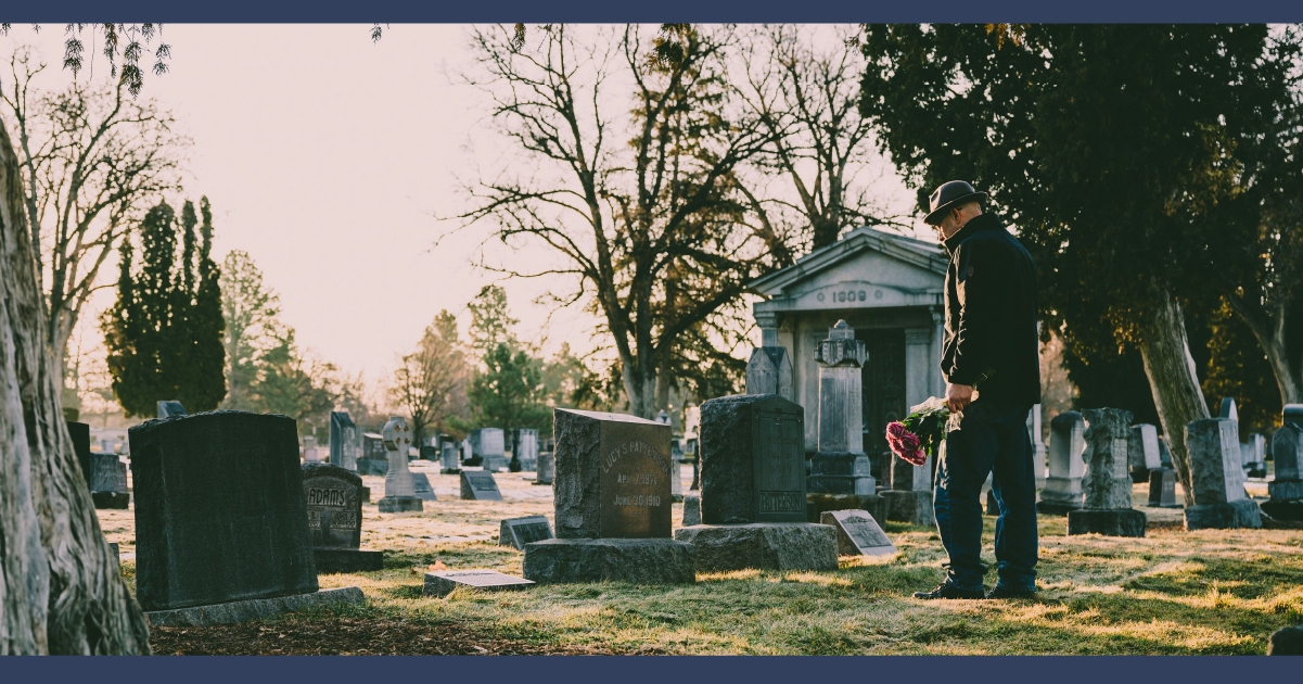 Person visiting graveside