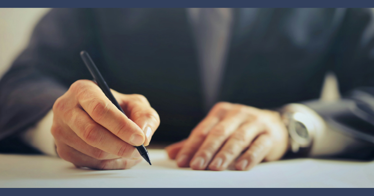 Lawyer signing a document