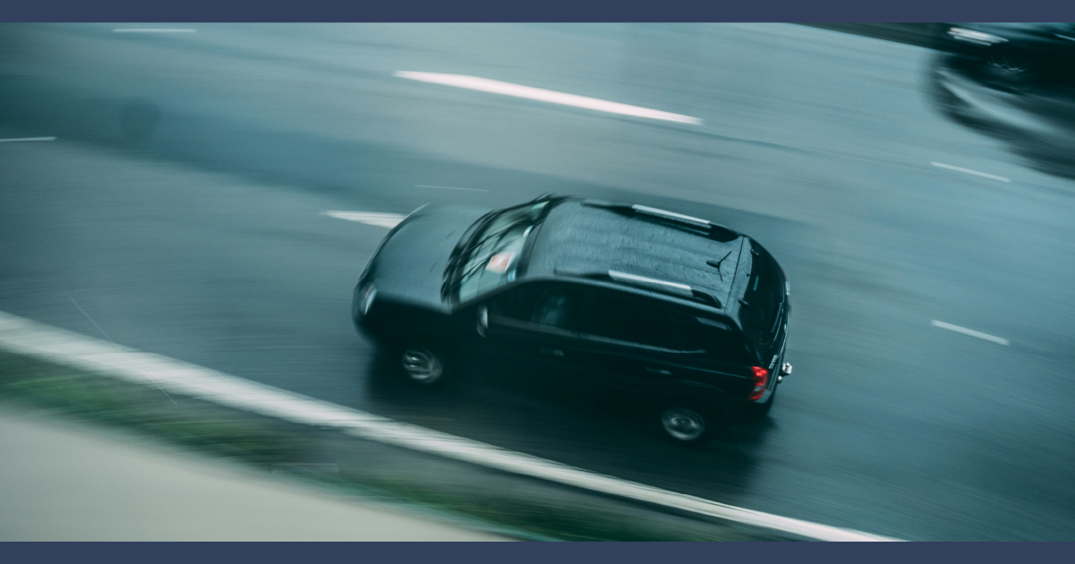 Car speeding along a busy road